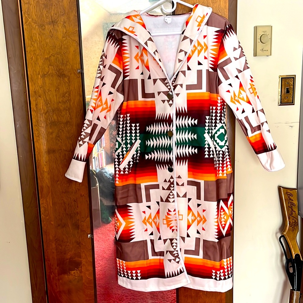 New condition! Great aztec button up coat! Two pockets and hood!
